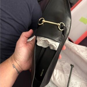 Black leather Loafers with Gold Detail